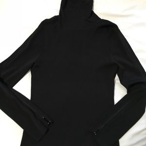black turtleneck with zippered sleeves